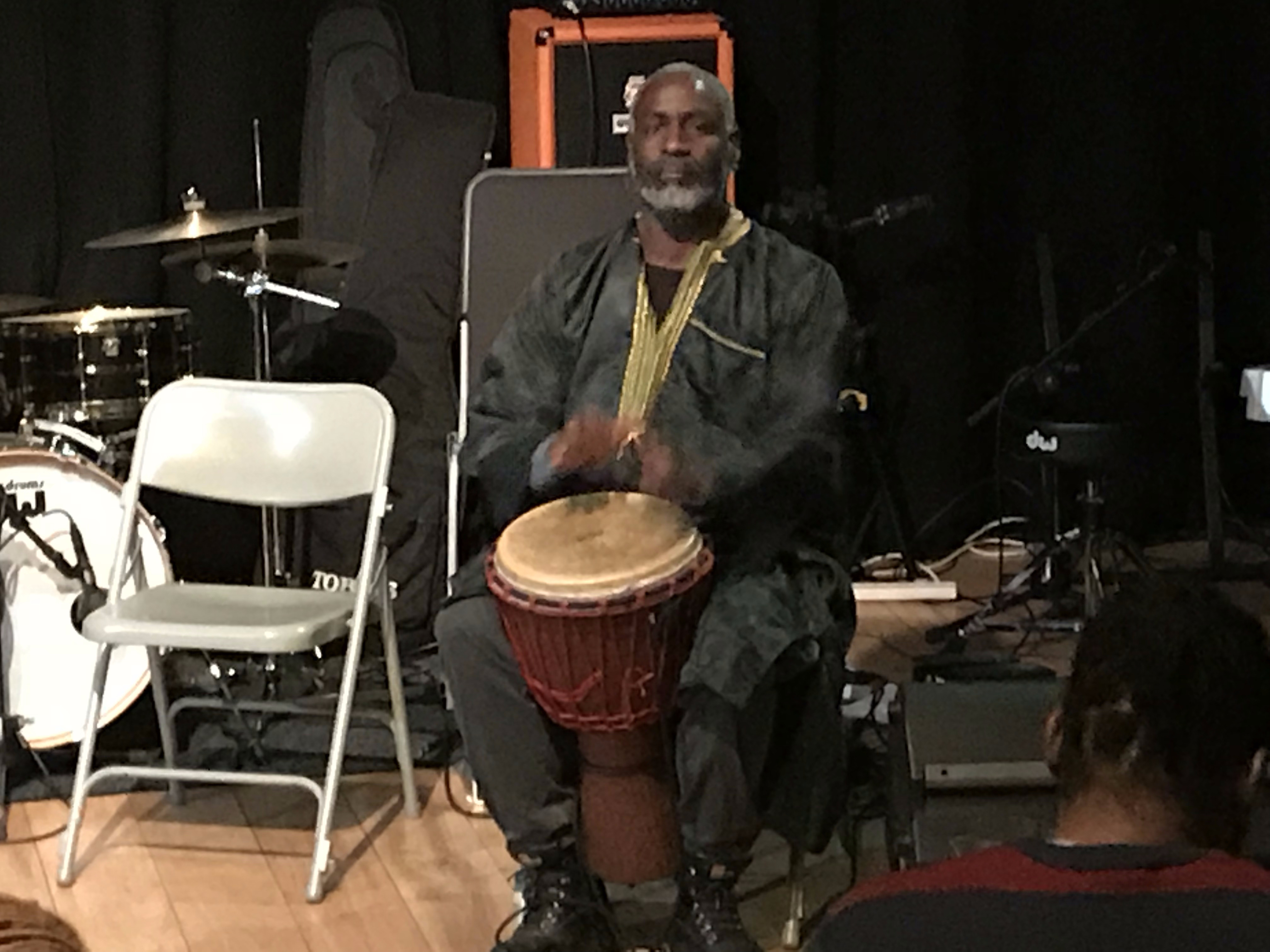 Djembe drumming performance on stage