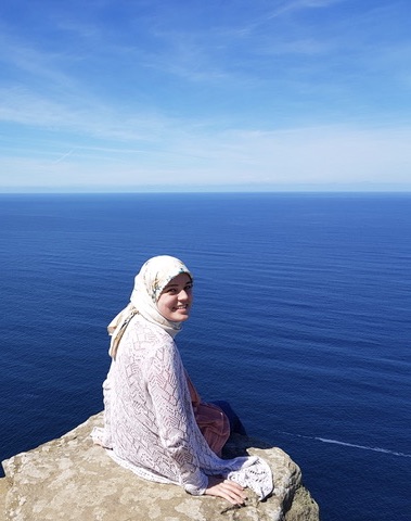 Portrait on a clifftop overlooking the sea