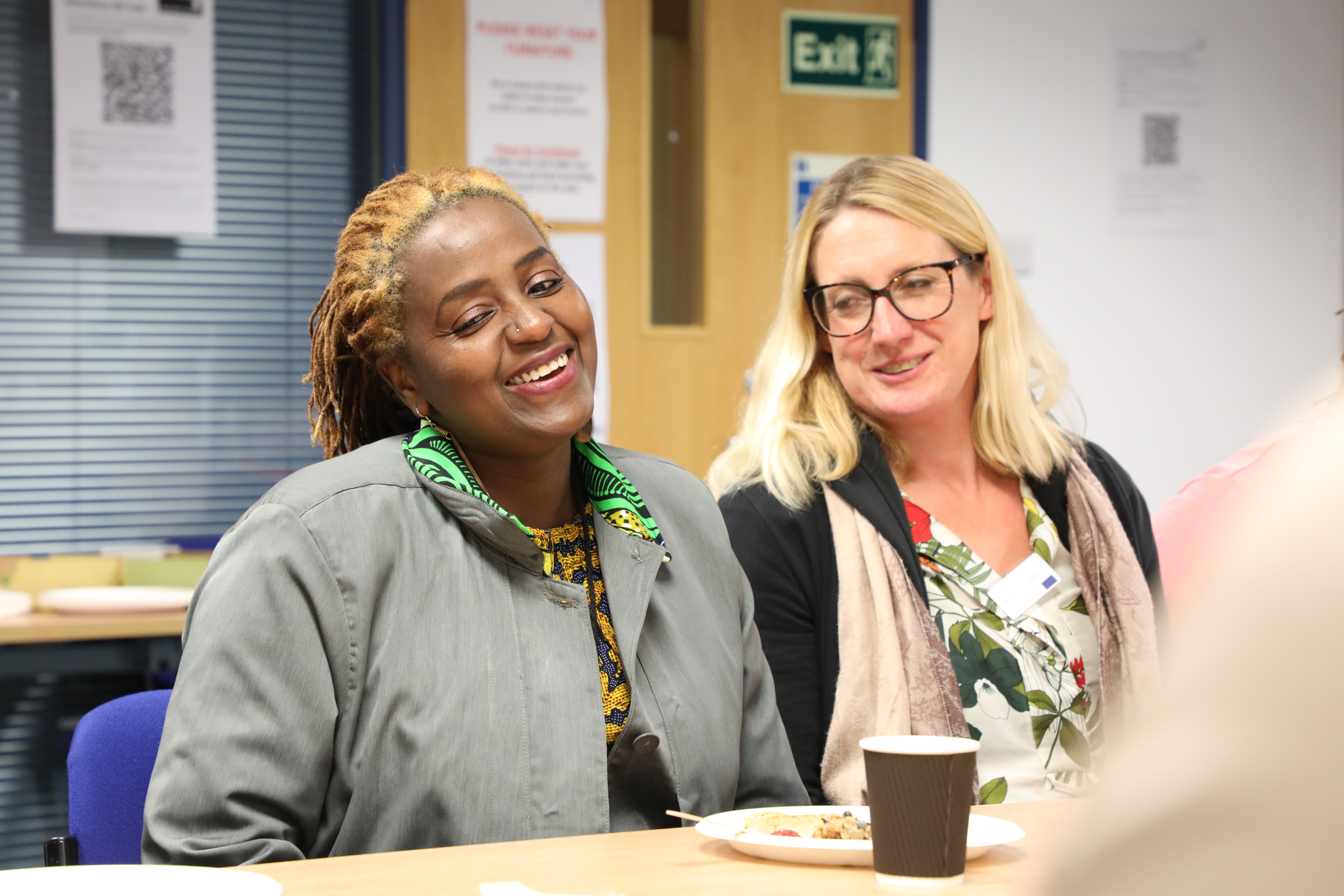 Two women smiling at workshop