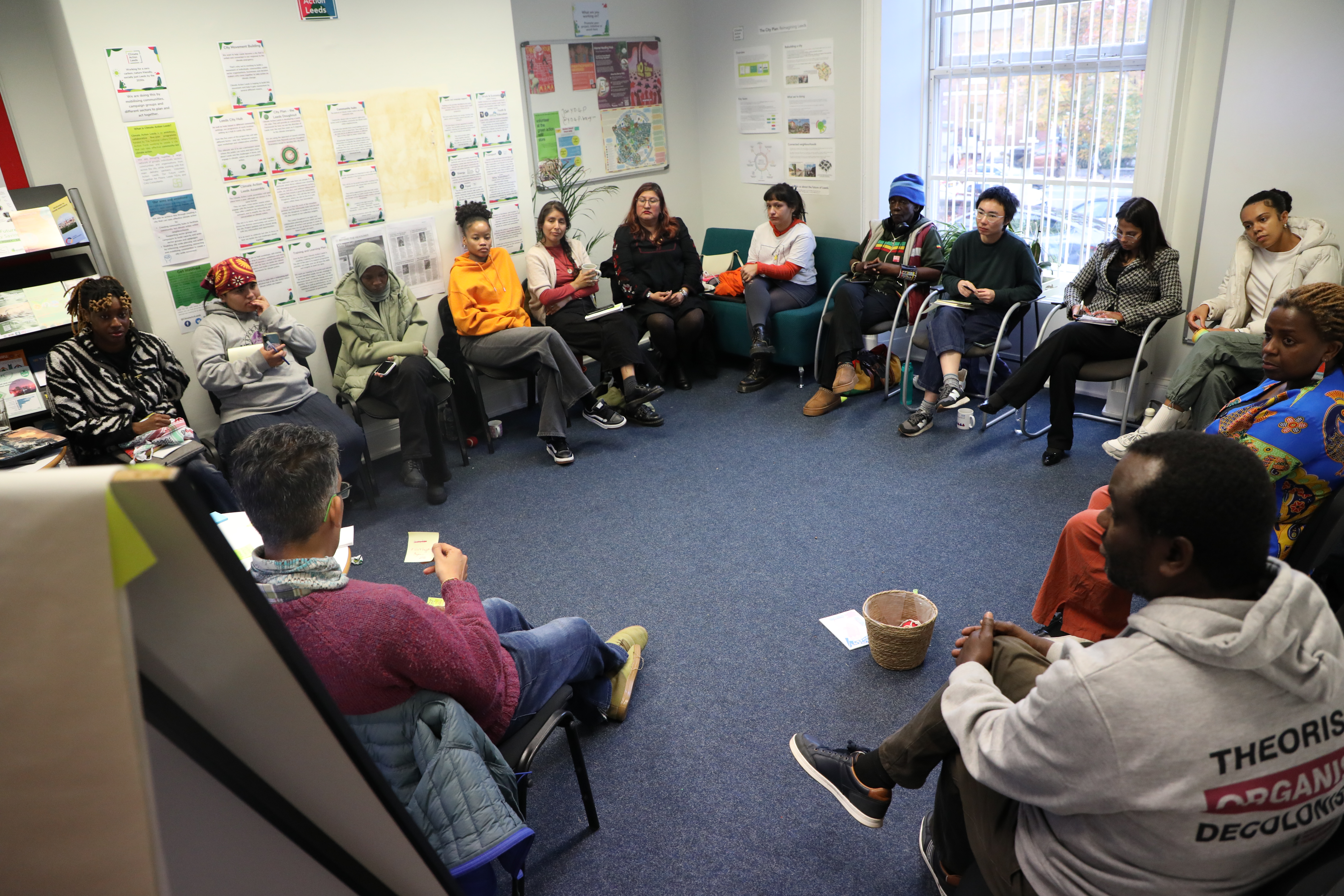 Group seated in circle for workshop discussion